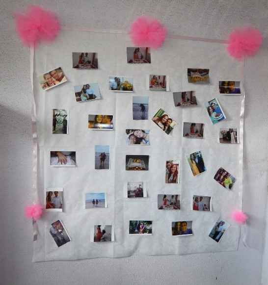 Painel de fotos, atras da mesa dos bolos