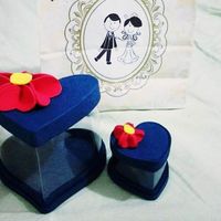 A lembrancinha, caixinhas e sacolinha personalizada 