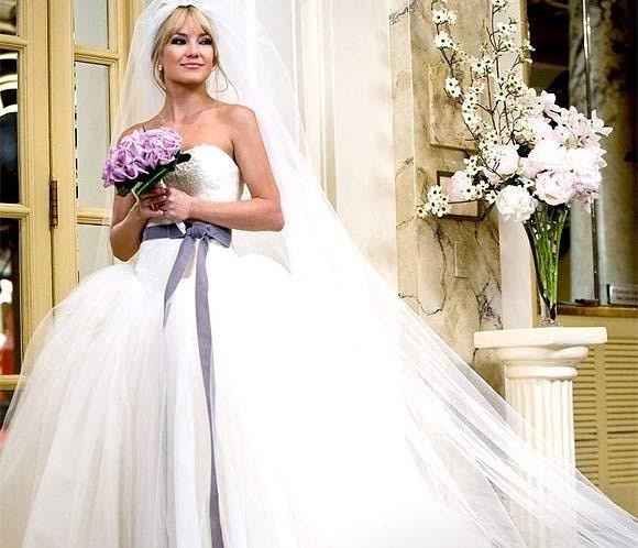 O buquê combinou bastante com vestido.