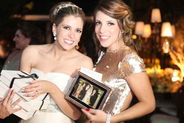 com as fotos dos padrinhos n casamento 