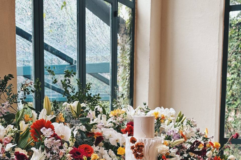 Mesa de bolos e doces