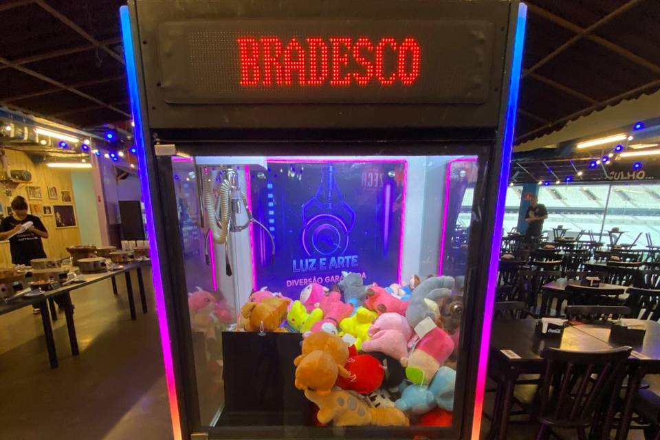 Grua de pelúcia e brindes