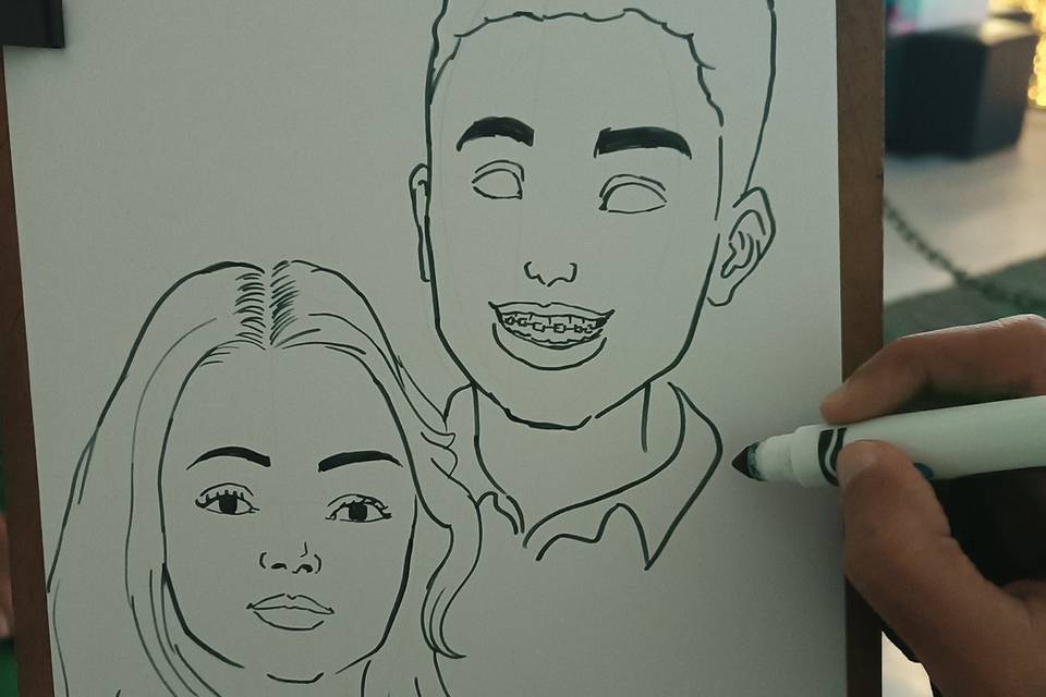 Desenhando caricatura em dupla