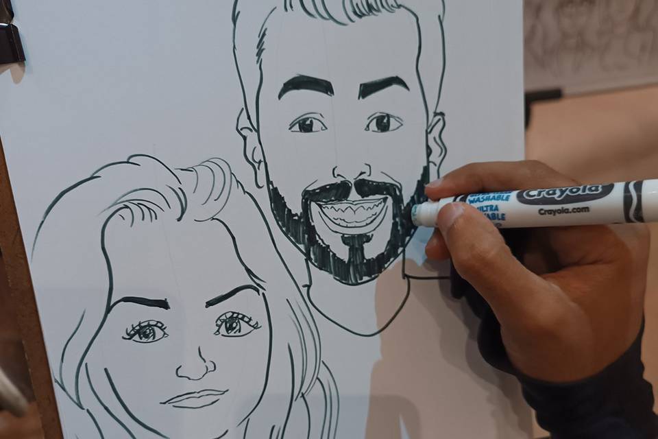 Casal em caricatura ao vivo