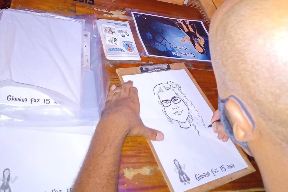 Caricaturas ao vivo em evento.